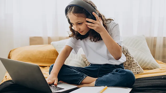 Child completing an online assessment